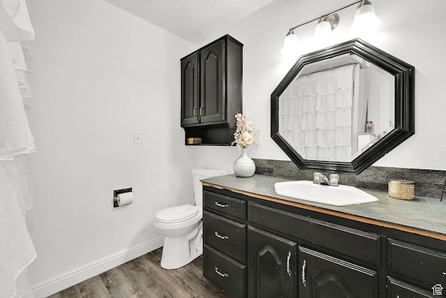 2195 W 4250 S, Roy, UT 84067 - bathroom featuring vanity, toilet, and wood finished floors