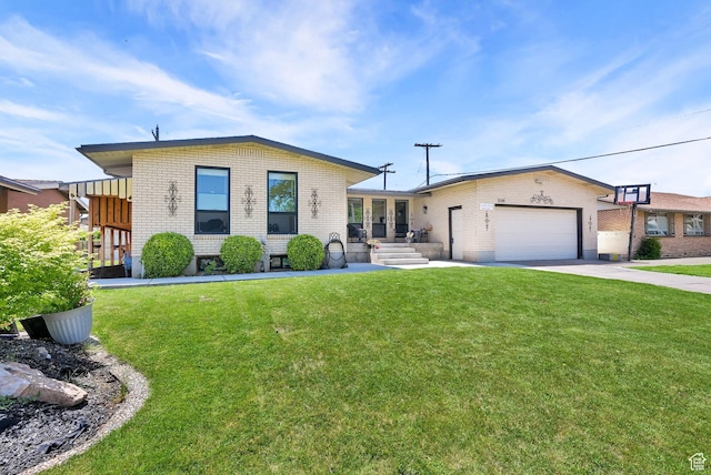 2195 W 4250 S, Roy, UT 84067 - view of front of home with brick siding, a front yard, and a garage