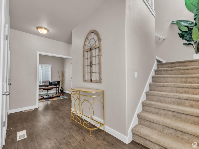 5636 W Lost Mine Ln, Herriman, UT 84096 - foyer entrance with stairway, dark wood finished floors, and baseboards