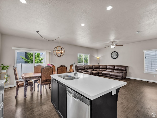 5636 W Lost Mine Ln, Herriman, UT 84096 - kitchen featuring stainless steel dishwasher, a sink, light countertops, a textured ceiling, and dark wood-type flooring