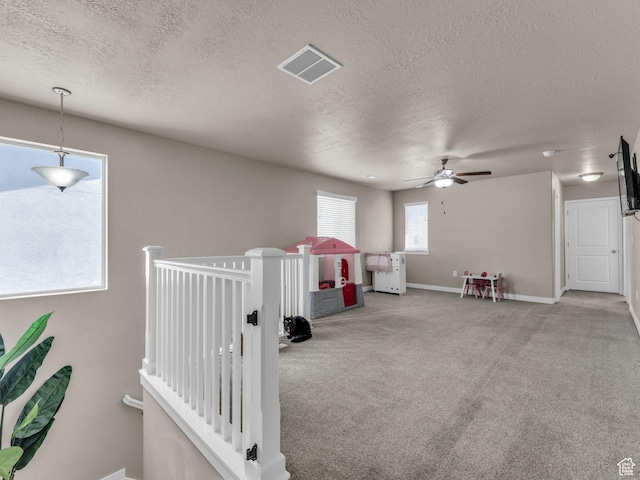 5636 W Lost Mine Ln, Herriman, UT 84096 - game room with a textured ceiling, carpet flooring, a ceiling fan, and baseboards