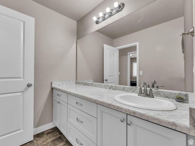 5636 W Lost Mine Ln, Herriman, UT 84096 - bathroom with vanity and baseboards