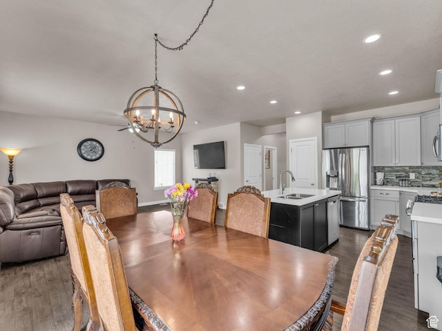 5636 W Lost Mine Ln, Herriman, UT 84096 - dining room featuring a chandelier, recessed lighting, and dark wood finished floors