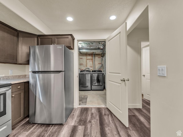 5636 W Lost Mine Ln, Herriman, UT 84096 - kitchen featuring stainless steel appliances, washing machine and dryer, wood finished floors, dark brown cabinetry, and recessed lighting