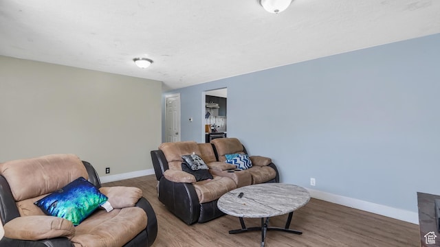 1951 W 7125 S, West Jordan, UT 84084 - living room featuring wood finished floors and baseboards