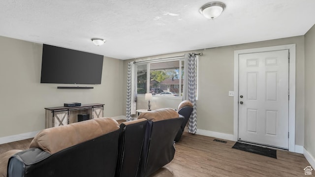 1951 W 7125 S, West Jordan, UT 84084 - living area with baseboards, wood finished floors, and a textured ceiling