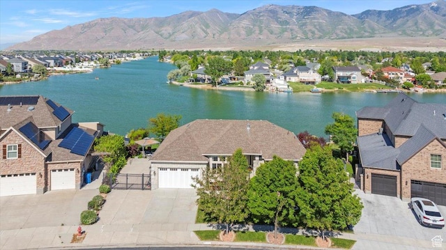 6142 N Schooner Ln, Stansbury Park, UT 84074 - aerial view of residential area featuring a water and mountain view