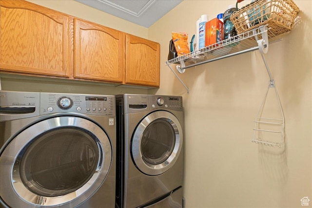 6142 N Schooner Ln, Stansbury Park, UT 84074 - laundry area with cabinet space and washer and clothes dryer