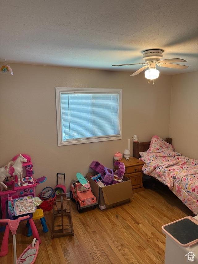 239 W Plum St, Grantsville, UT 84029 - bedroom with light wood finished floors and ceiling fan