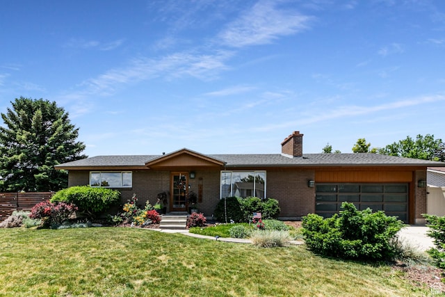 5768 S Blake Dr, Taylorsville, UT 84129 - single story home with brick siding, a garage, and a chimney