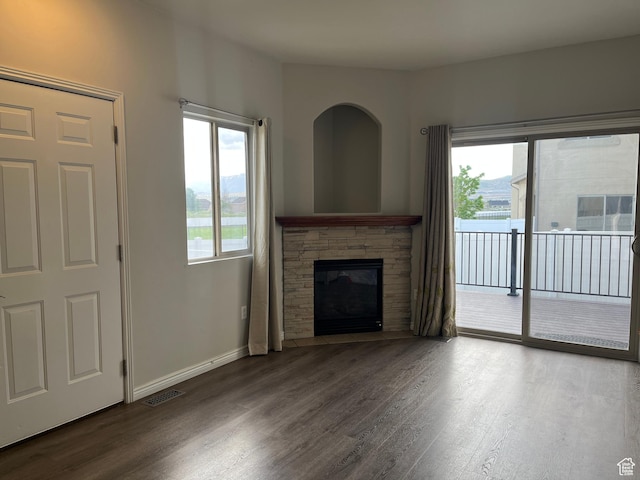 2027 W 2175 N, Lehi, UT 84043 - unfurnished living room featuring wood finished floors, a fireplace, and baseboards
