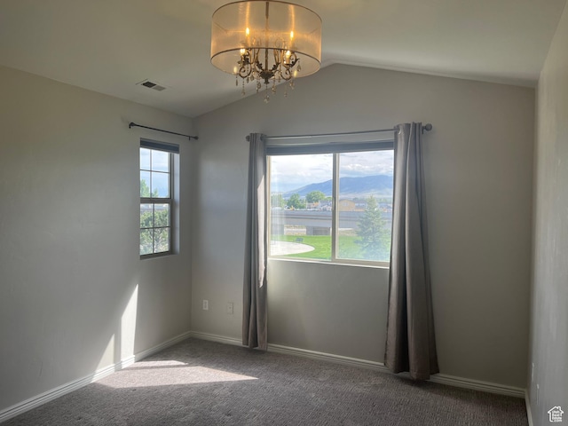 2027 W 2175 N, Lehi, UT 84043 - empty room featuring a chandelier, vaulted ceiling, carpet floors, and baseboards