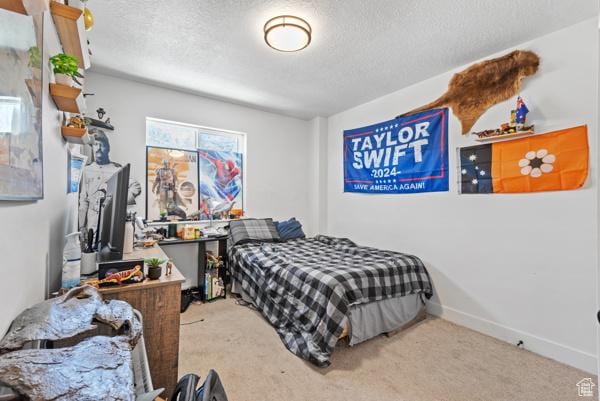 1024 E 1300 S Unit 31, Provo, UT 84606 - carpeted bedroom featuring a textured ceiling and baseboards
