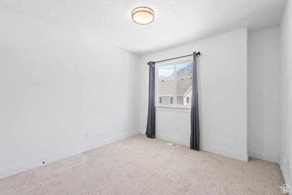 1024 E 1300 S Unit 31, Provo, UT 84606 - spare room featuring light colored carpet and baseboards