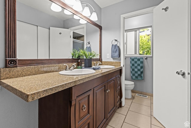 720 Freedom Cir N, Salt Lake, UT 84054 - bathroom featuring double vanity, toilet, tile patterned floors, and a shower with door