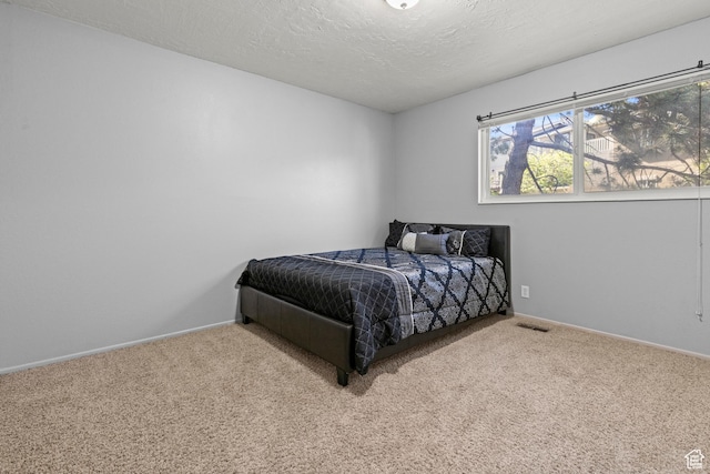 720 Freedom Cir N, Salt Lake, UT 84054 - carpeted bedroom with baseboards and a textured ceiling