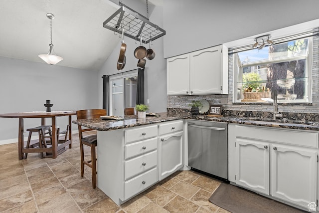 720 Freedom Cir N, Salt Lake, UT 84054 - kitchen featuring stainless steel dishwasher, a peninsula, white cabinetry, a sink, and tasteful backsplash