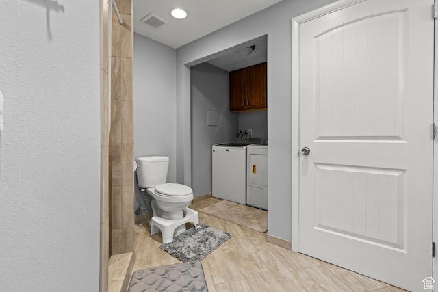 720 Freedom Cir N, Salt Lake, UT 84054 - bathroom with washing machine and dryer, toilet, wood finished floors, a shower, and vanity