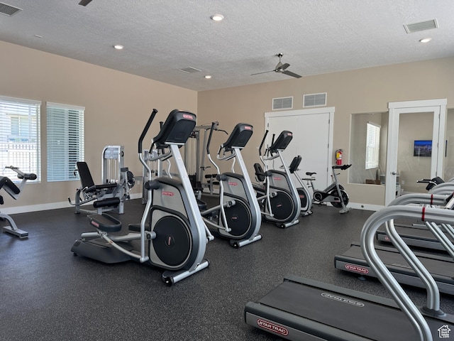 5308 W Solafax Ln S, Herriman, UT 84096 - gym featuring a textured ceiling, plenty of natural light, a ceiling fan, and recessed lighting