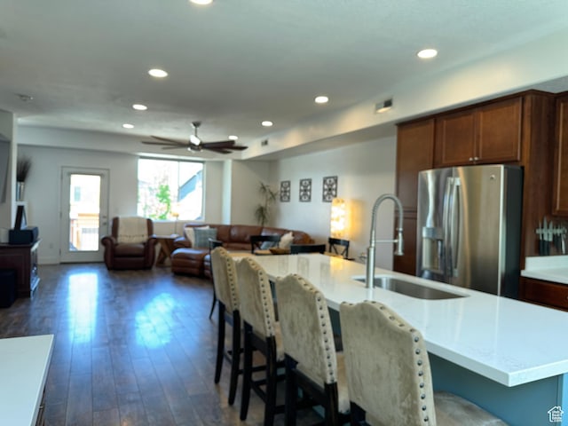 5308 W Solafax Ln S, Herriman, UT 84096 - kitchen with stainless steel fridge, open floor plan, light countertops, dark wood-style floors, and ceiling fan