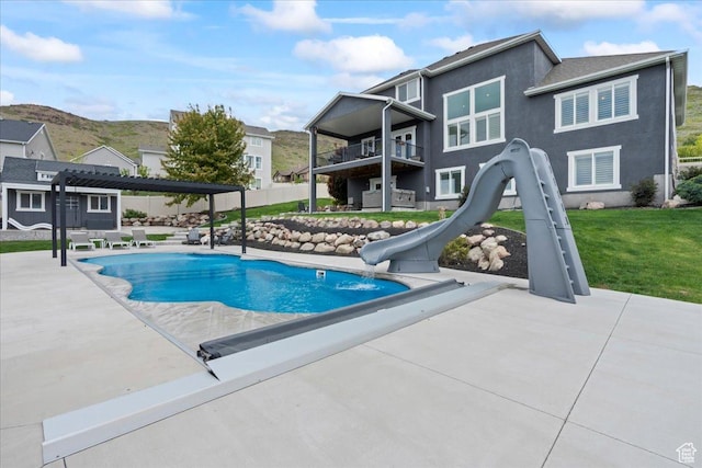 6688 W Buck Dr, Herriman, UT 84096 - view of pool with a water slide, a patio area, a yard, and a pergola