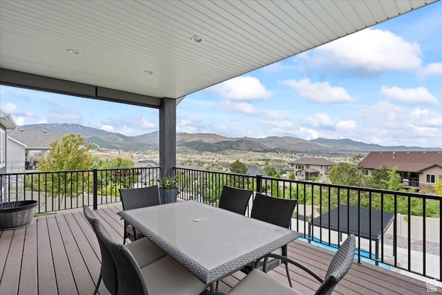 6688 W Buck Dr, Herriman, UT 84096 - wooden deck featuring a mountain view, outdoor dining area, and a residential view