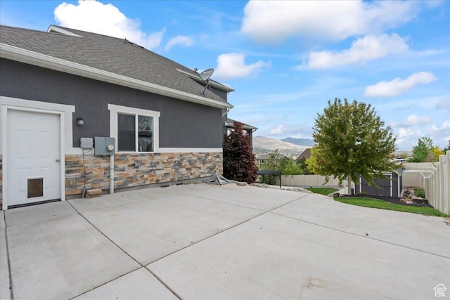6688 W Buck Dr, Herriman, UT 84096 - fenced backyard featuring a patio area and a mountain view