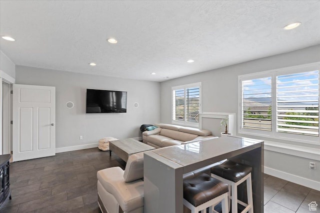 6688 W Buck Dr, Herriman, UT 84096 - living area featuring recessed lighting, baseboards, and a textured ceiling