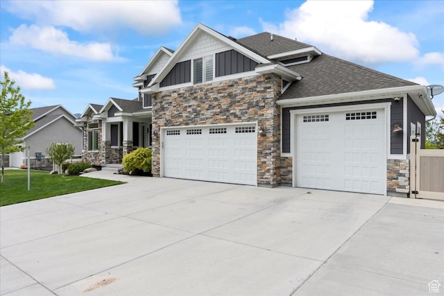 6688 W Buck Dr, Herriman, UT 84096 - craftsman-style home featuring stone siding, board and batten siding, driveway, a shingled roof, and a front yard