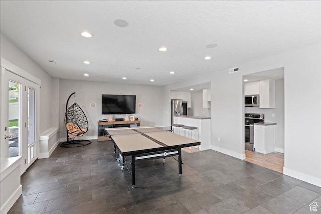 6688 W Buck Dr, Herriman, UT 84096 - recreation room with recessed lighting and baseboards