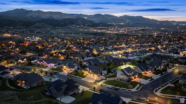 6688 W Buck Dr, Herriman, UT 84096 - aerial view of property's location featuring a mountain backdrop and nearby suburban area
