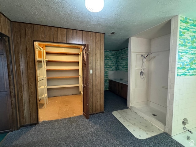 109 W 300 S, Holden, UT 84636 - bathroom with a shower, a textured ceiling, a closet, and wood walls