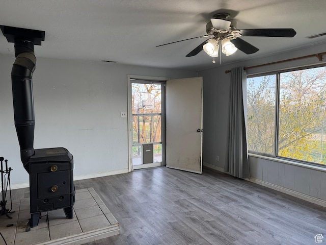 109 W 300 S, Holden, UT 84636 - unfurnished living room with wood finished floors, ceiling fan, and baseboards