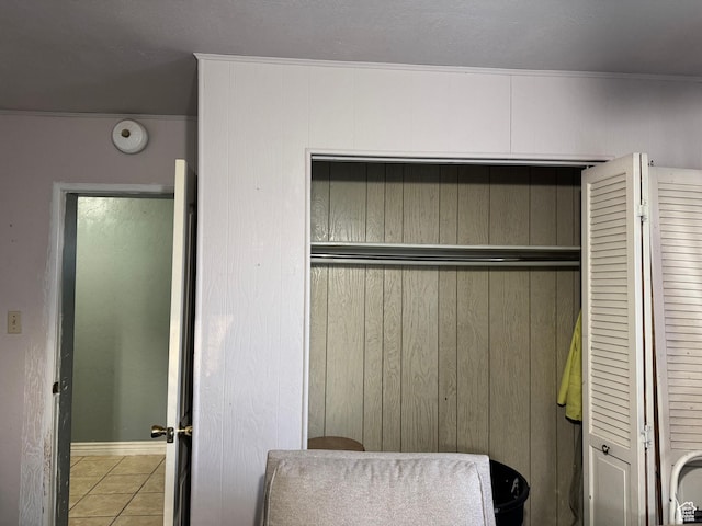109 W 300 S, Holden, UT 84636 - bedroom featuring tile patterned floors, a closet, wood walls, and baseboards