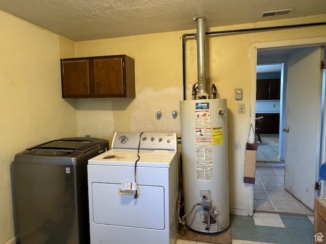 109 W 300 S, Holden, UT 84636 - laundry area featuring gas water heater, separate washer and dryer, cabinet space, and a textured ceiling