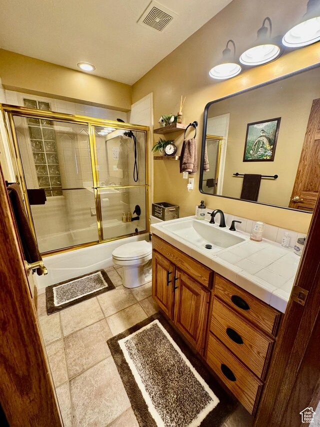 1660 E 900 S Unit 19, Clearfield, UT 84015 - bathroom with toilet, vanity, and combined bath / shower with glass door