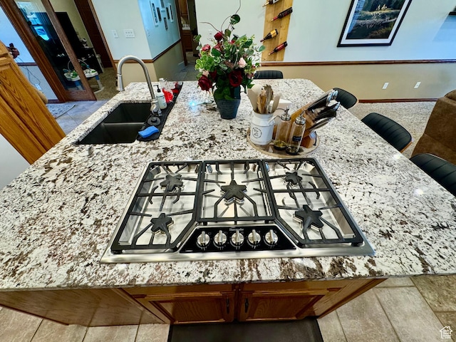 1660 E 900 S Unit 19, Clearfield, UT 84015 - kitchen featuring a sink, stainless steel gas stovetop, and light stone countertops