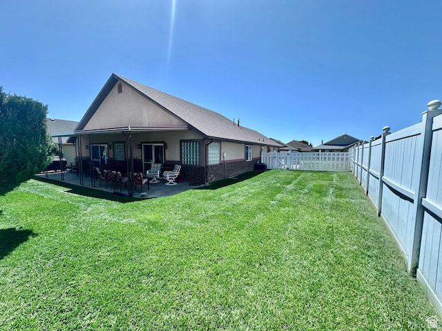 1660 E 900 S Unit 19, Clearfield, UT 84015 - rear view of house with a patio area