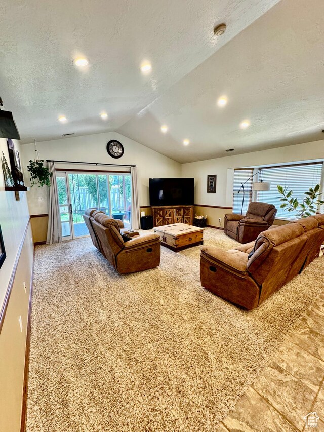 1660 E 900 S Unit 19, Clearfield, UT 84015 - carpeted living area featuring vaulted ceiling, a textured ceiling, and recessed lighting