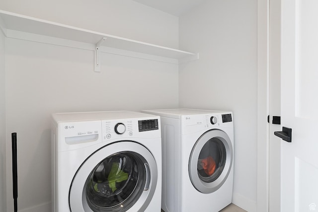 4945 W Willowbank Dr W, Highland, UT 84003 - washroom featuring washing machine and dryer and baseboards