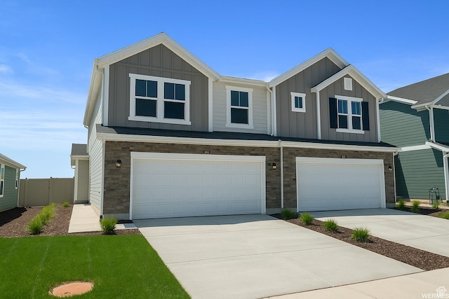 4945 W Willowbank Dr W, Highland, UT 84003 - view of front facade with board and batten siding, a garage, and concrete driveway