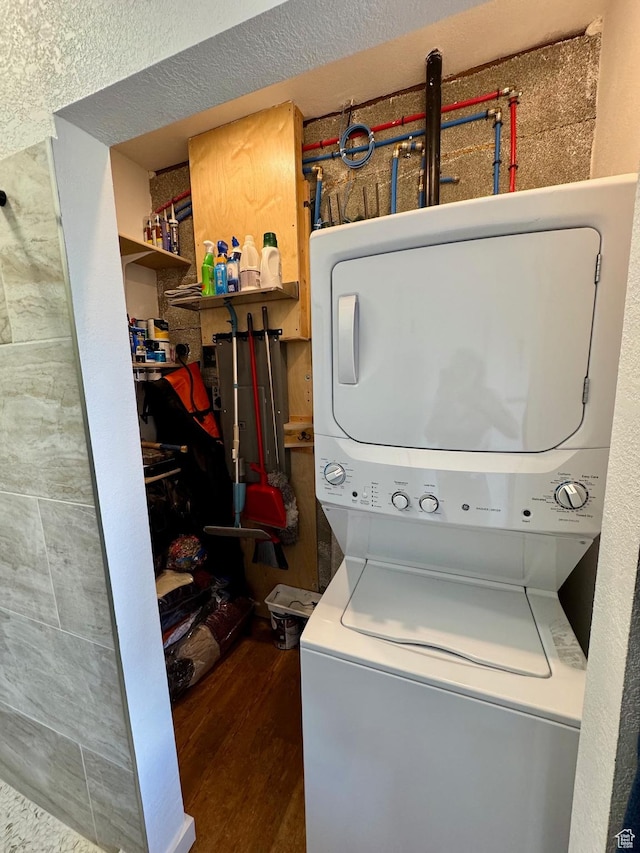 357 Juniper Dr Unit 480, Fish Haven, ID 83287 - washroom with stacked washer / drying machine and dark wood-style flooring