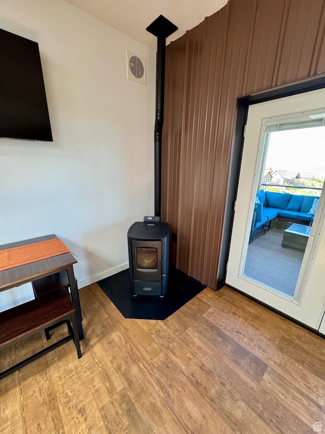 357 Juniper Dr Unit 480, Fish Haven, ID 83287 - living area with a wood stove, wood finished floors, and baseboards
