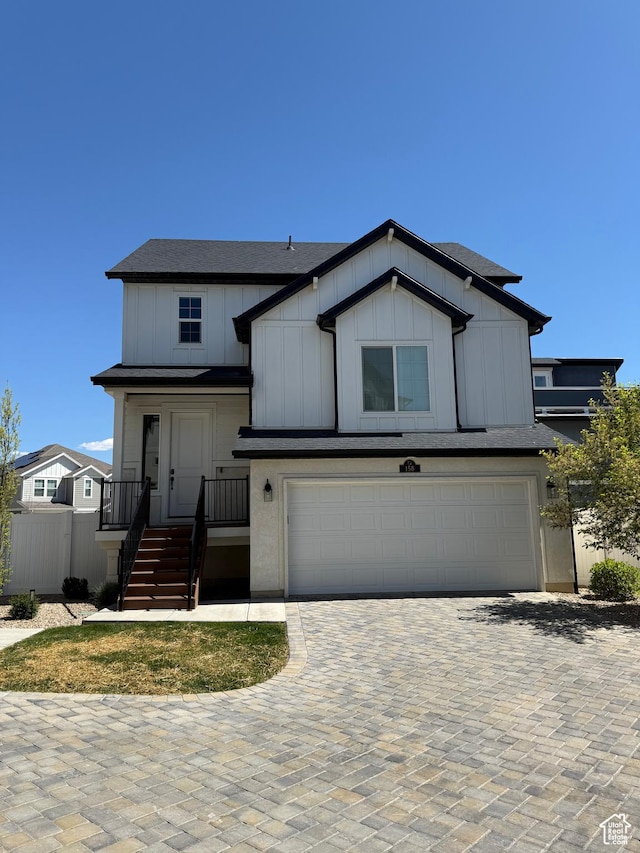 158 E Polaris Dr S, Saratoga Springs, UT 84045 - view of front of property featuring a garage, decorative driveway, board and batten siding, and a shingled roof