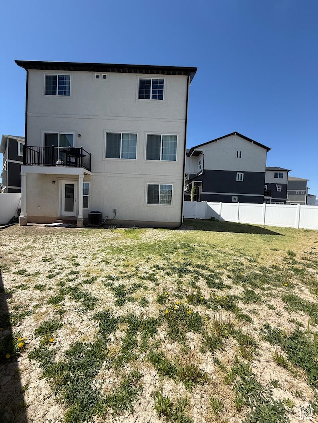 158 E Polaris Dr S, Saratoga Springs, UT 84045 - rear view of property featuring central AC unit, a balcony, and stucco siding