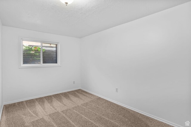 9224 S Benson Way, Sandy, UT 84070 - carpeted empty room featuring baseboards and a textured ceiling