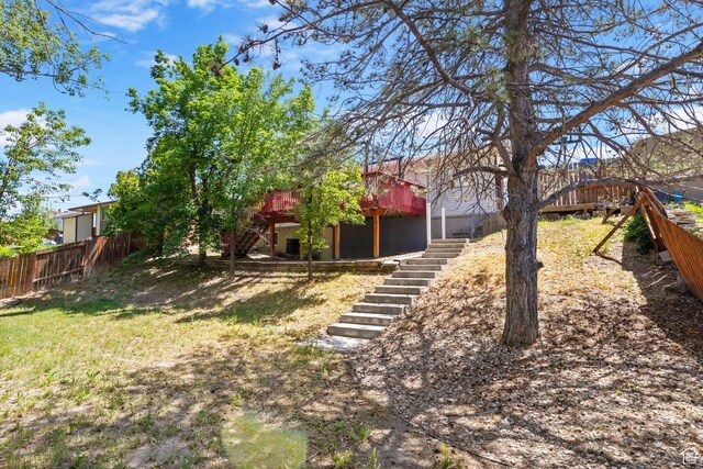 9224 S Benson Way, Sandy, UT 84070 - view of yard with stairway and a wooden deck