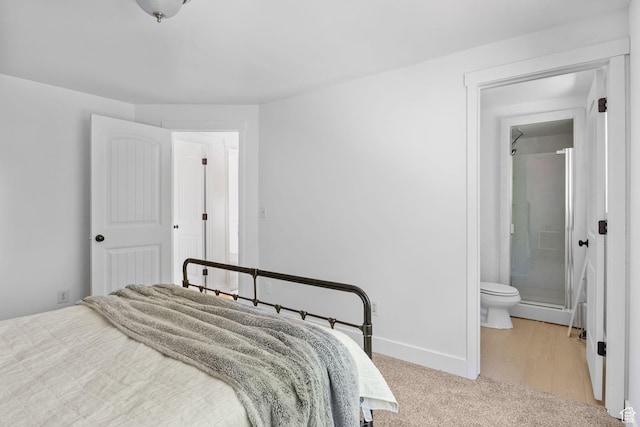 9224 S Benson Way, Sandy, UT 84070 - carpeted bedroom featuring ensuite bath and baseboards