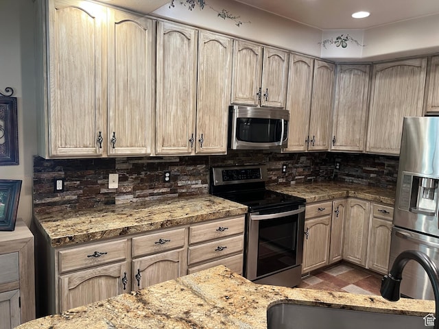 93 E Sweet Berry Ct, Draper, UT 84020 - kitchen with stainless steel appliances, decorative backsplash, and light stone counters