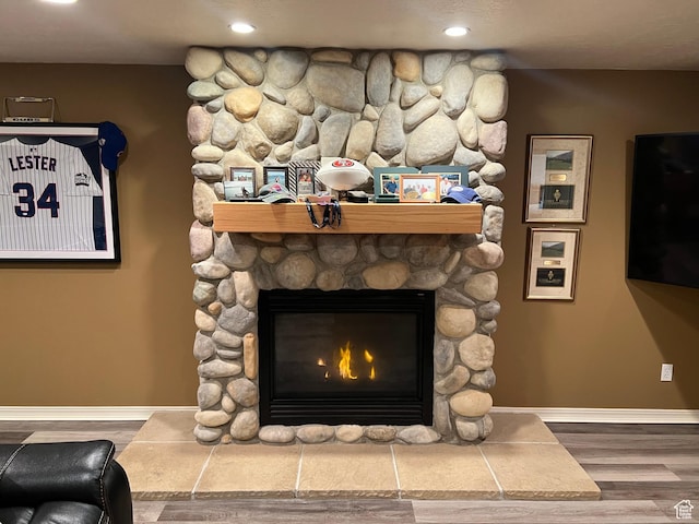 93 E Sweet Berry Ct, Draper, UT 84020 - detailed view of a stone fireplace, wood finished floors, and recessed lighting